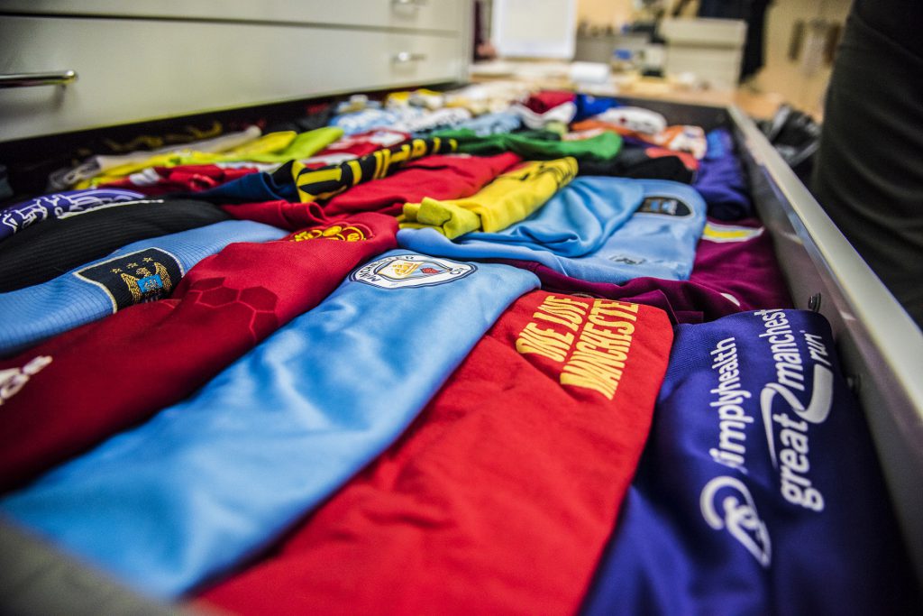 A drawer of football shirts in the archive