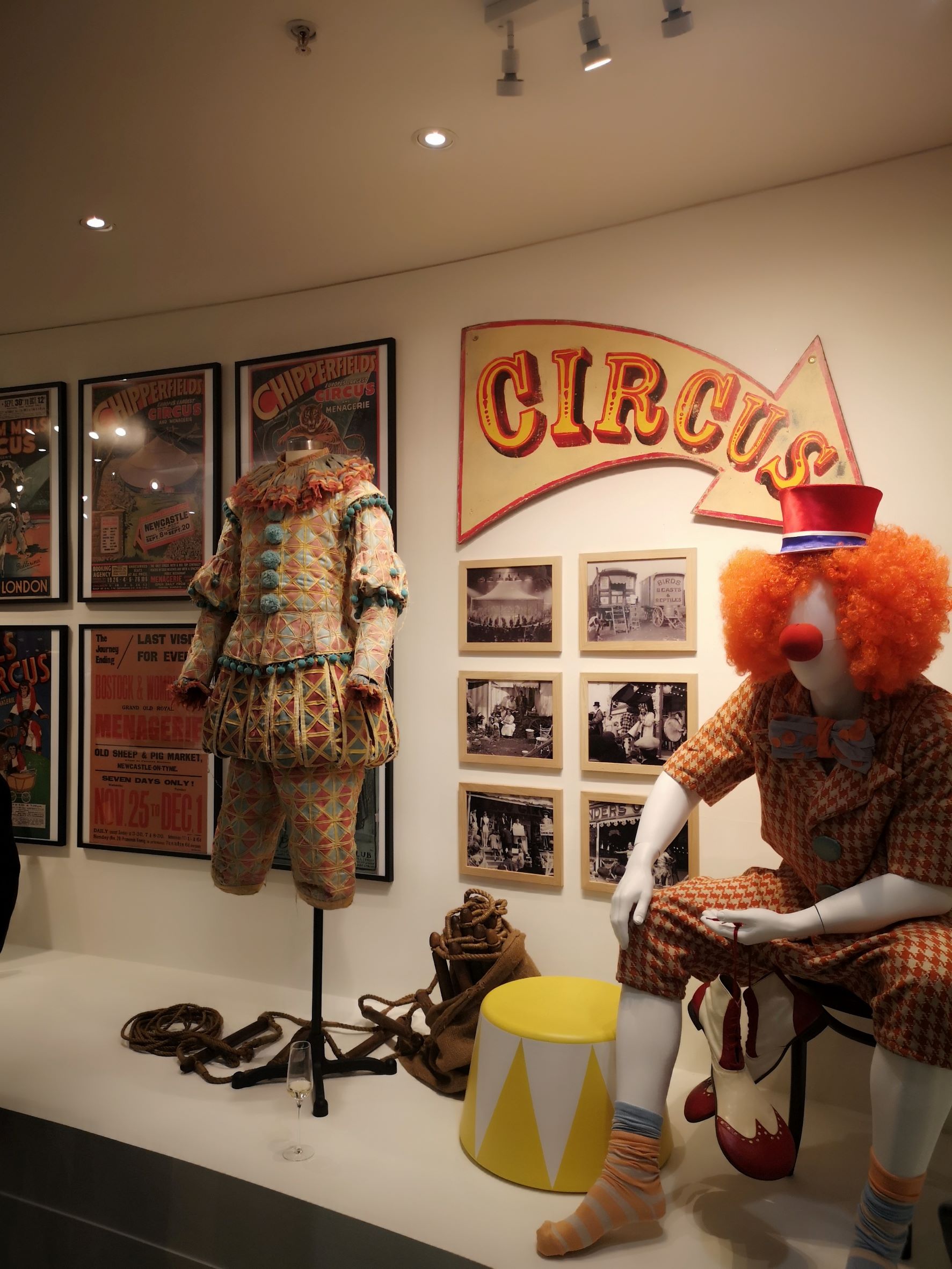 An exhibition displaying outfits and photographs from a circus