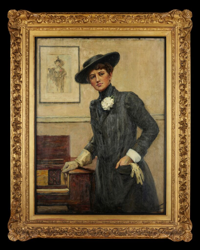 Oil painting of a woman standing, wearing a black wide-brimmed hat and a long black coat. She is resting her right hand on the frame of a piano. The frame of the paining is gold in colour, with intricate carved detailing